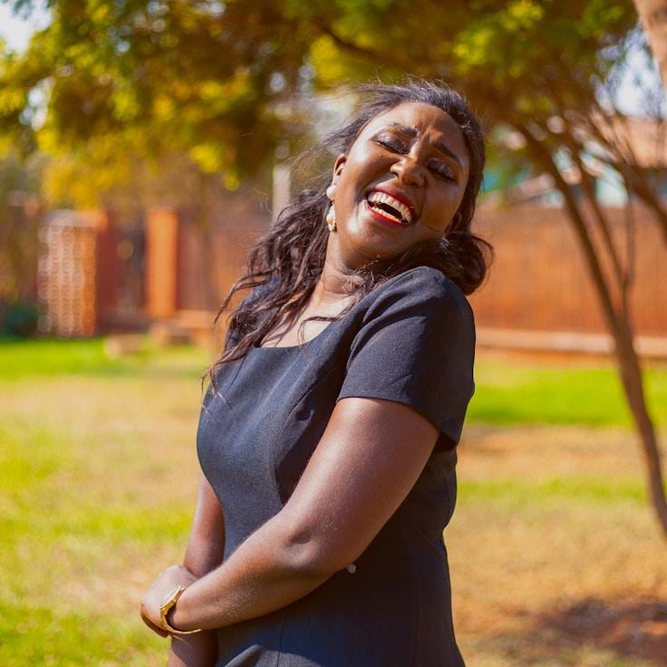 Kaveri Mehta, Lead Design Curator at Frame Haven Press, reviewing corporate floral arrangements